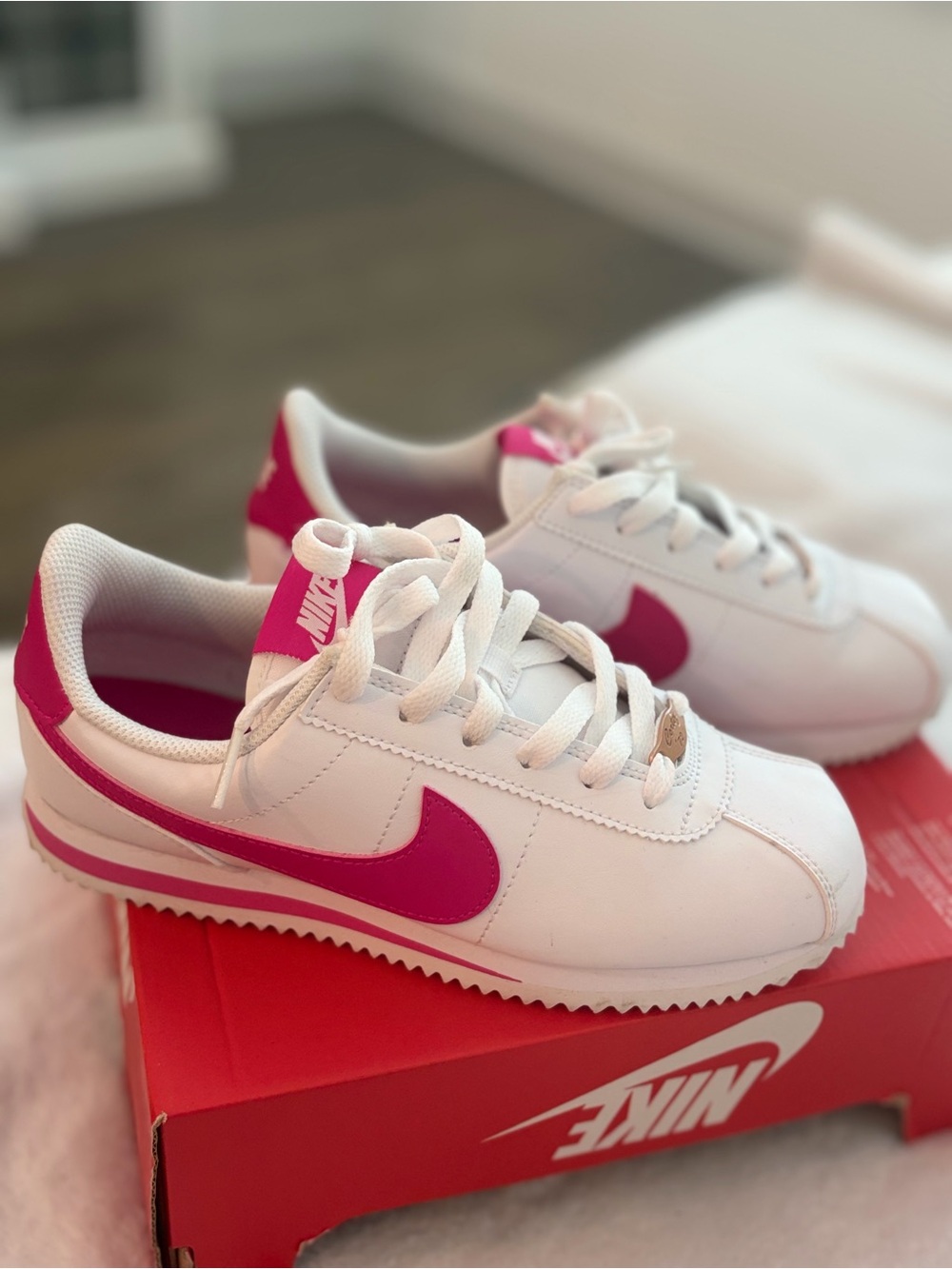 Nike White Sneakers with Pink Swoosh